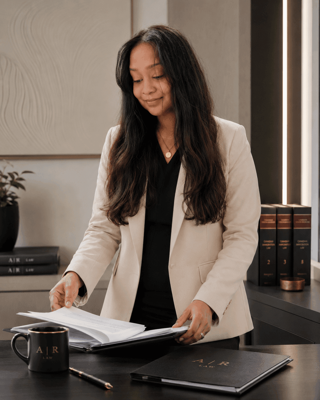 Annie Rupchand, J.D. meticulously reviewing Canadian immigration case files and statutory briefs